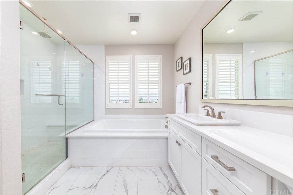 56 Swift Irvine, CA 92618 - Photo 17 of 43 a bathroom with a sink a toilet and bathtub