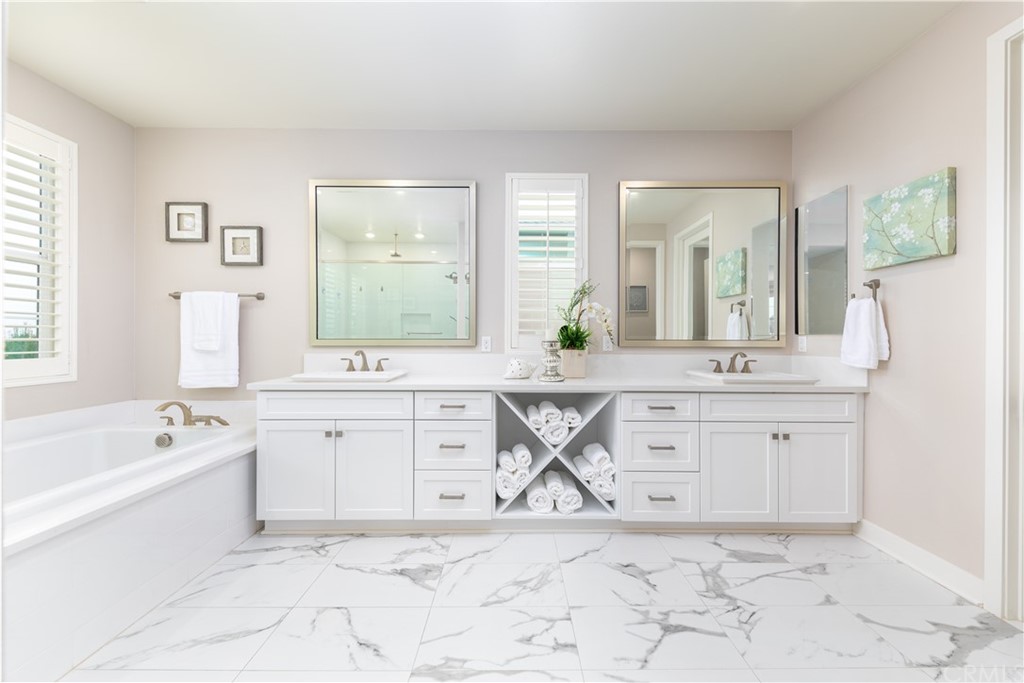 56 Swift Irvine, CA 92618 - Photo 18 of 43 a spacious bathroom with a granite countertop sink mirror and bathtub