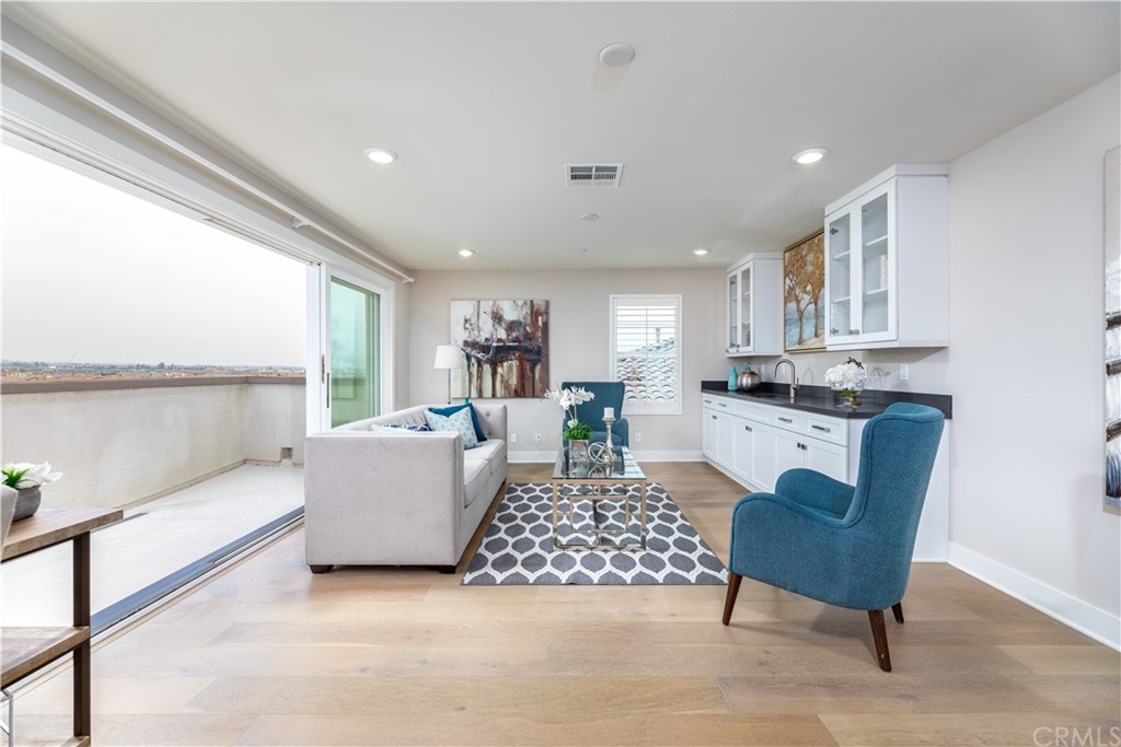56 Swift Irvine, CA 92618 - Photo 22 of 43 a living room with furniture and a large window