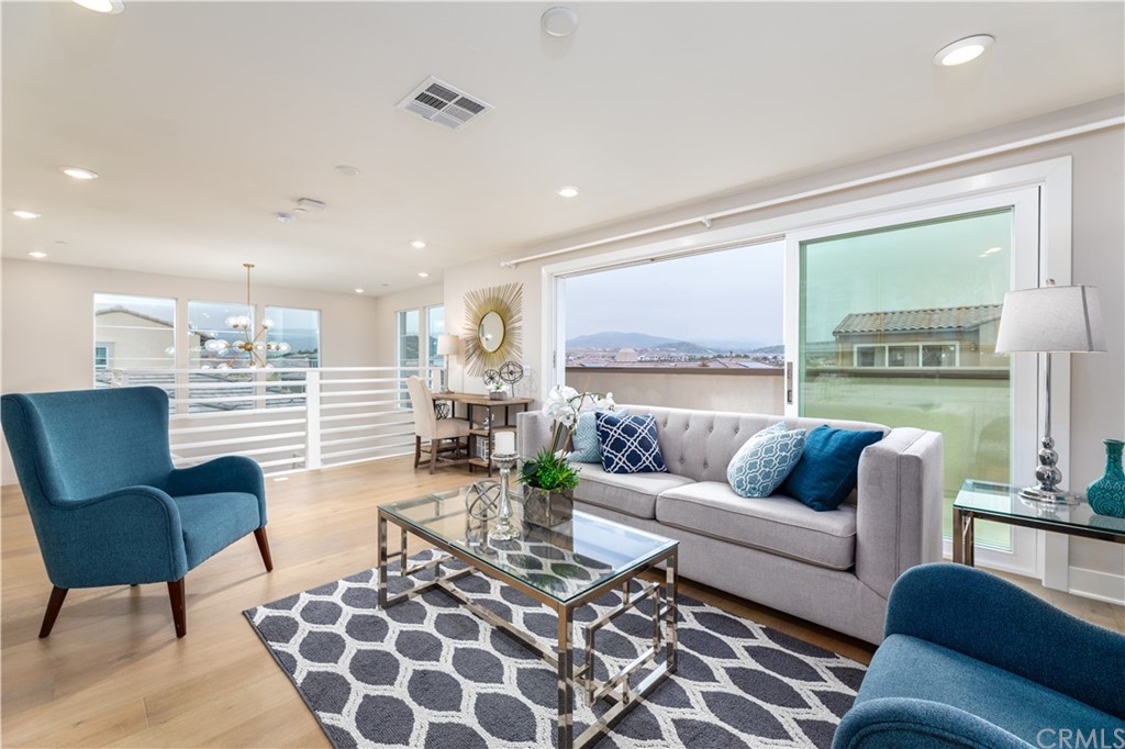 56 Swift Irvine, CA 92618 - Photo 24 of 43 a living room with furniture and a large window
