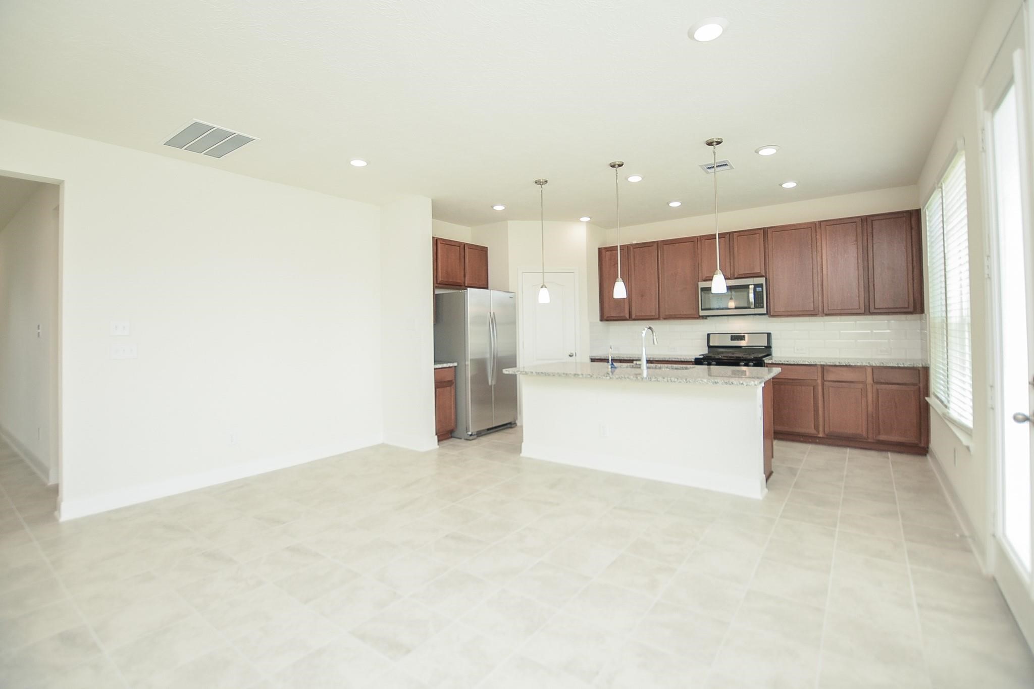 20907 Filbert Lane Katy, TX 77449 - Photo 13 of 43 a view of kitchen with kitchen island and stainless steel appliances