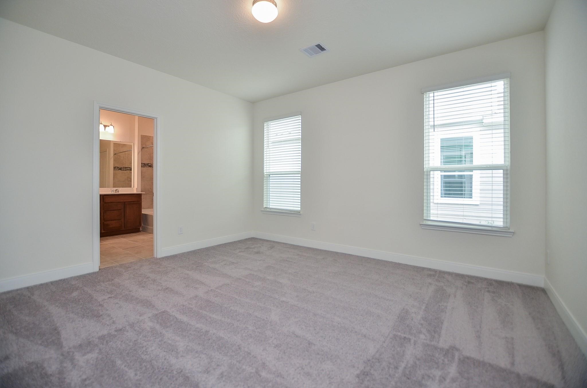 20907 Filbert Lane Katy, TX 77449 - Photo 18 of 43 an empty room with windows