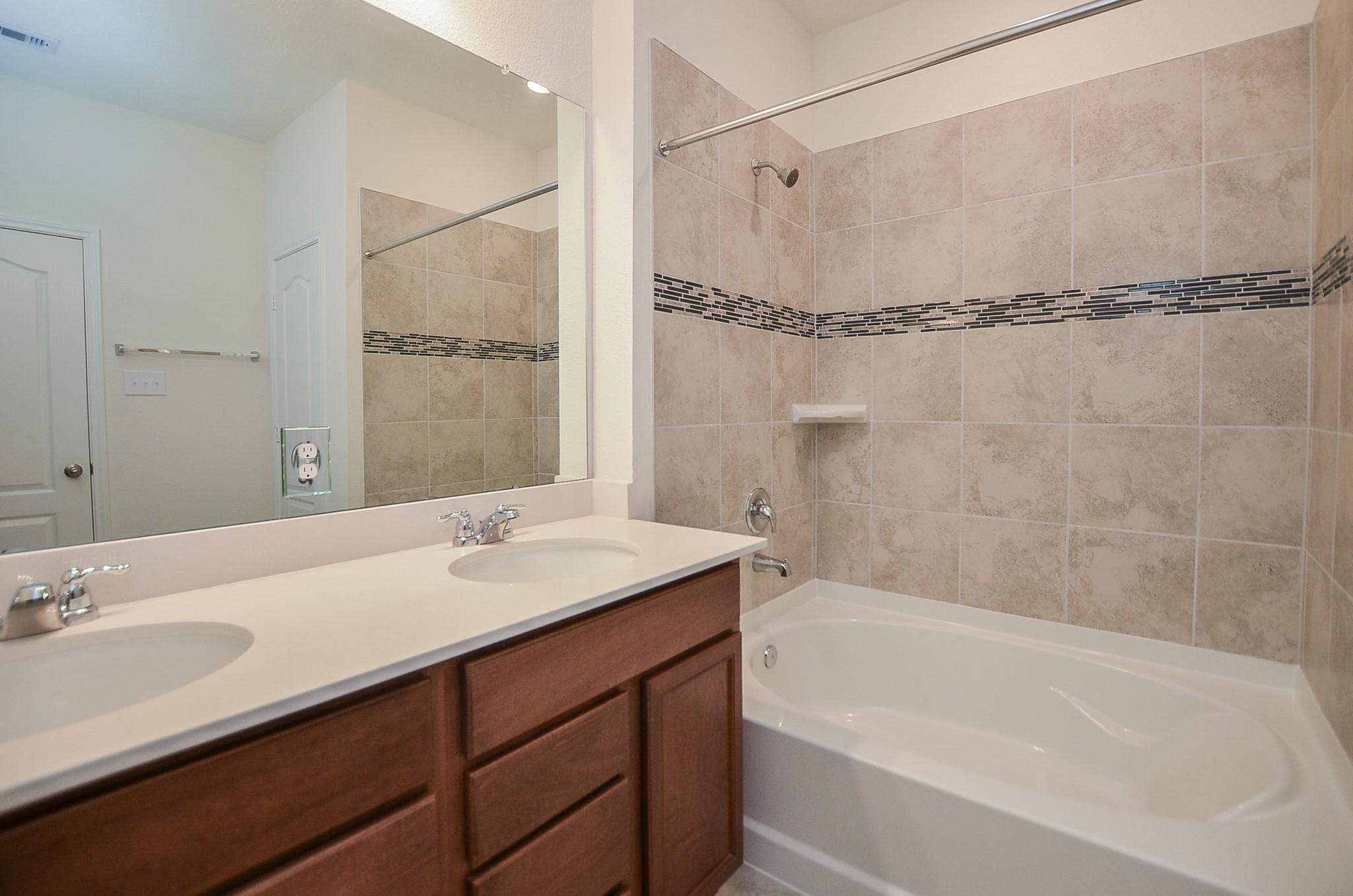 20907 Filbert Lane Katy, TX 77449 - Photo 21 of 43 a bathroom with a sink and a mirror