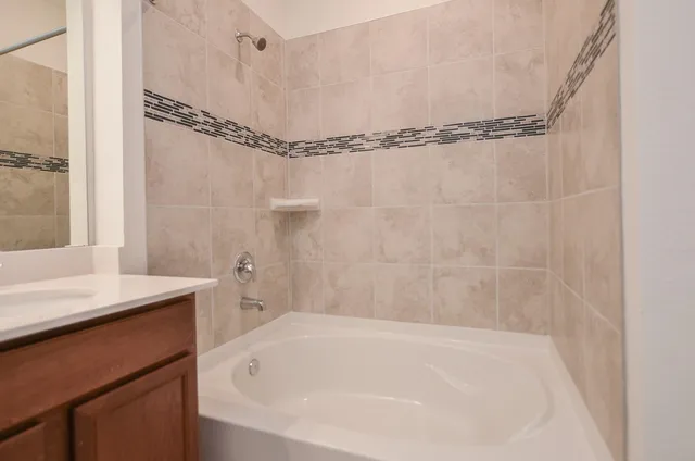 a bathroom with 2 sink and a mirror