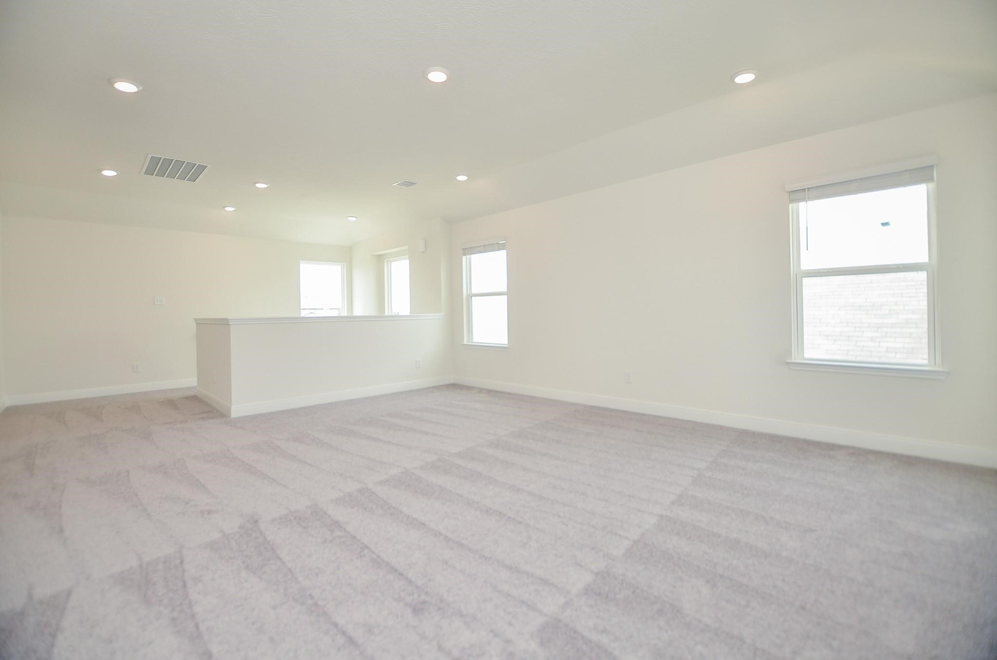 20907 Filbert Lane Katy, TX 77449 - Photo 26 of 43 an empty room with windows and entrance