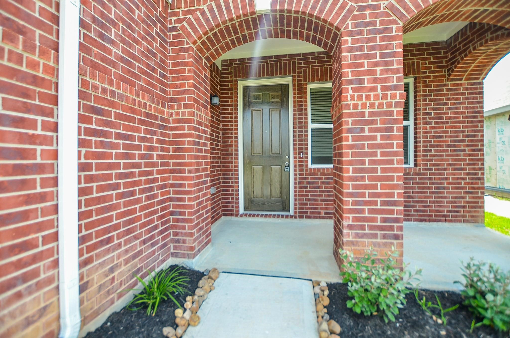 20907 Filbert Lane Katy, TX 77449 - Photo 4 of 43 a view of a brick house with plants