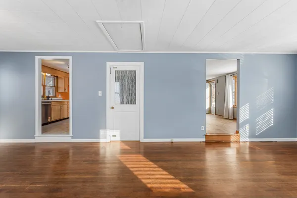 a view of a livingroom with wooden floor
