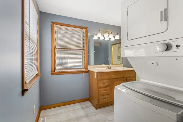a view of bathroom with a sink and a mirror