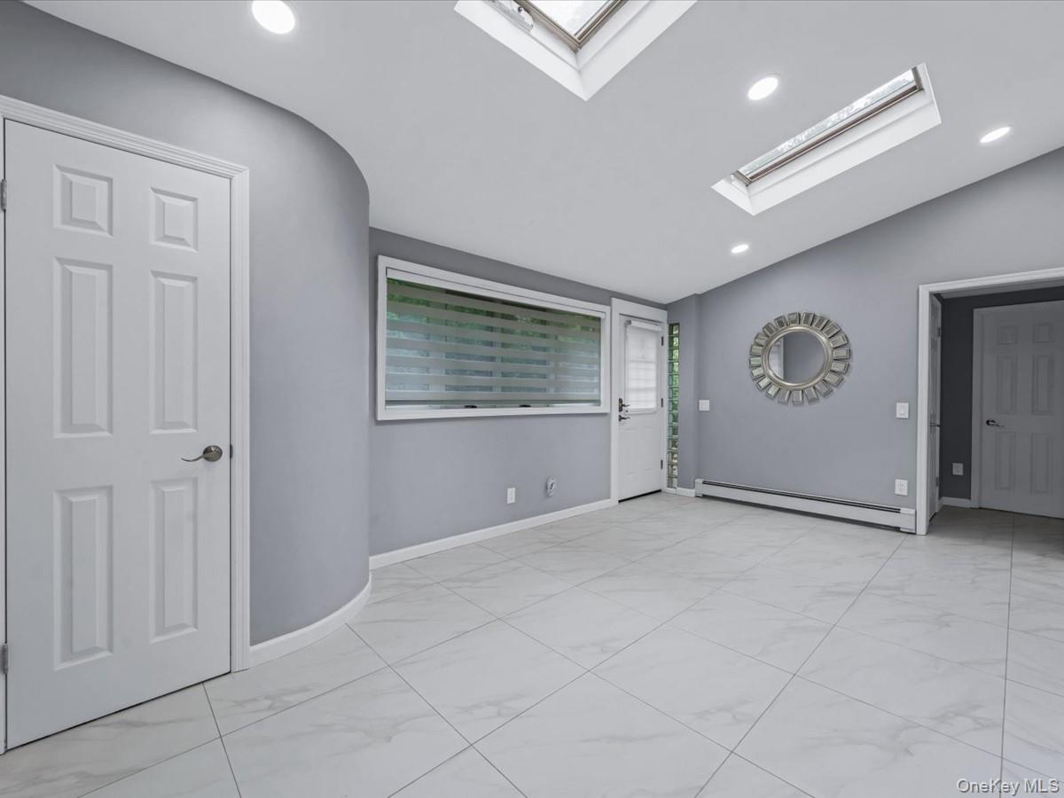 19 Ridge Drive East Roslyn, NY 11576 - Photo 14 of 33 an empty room with windows