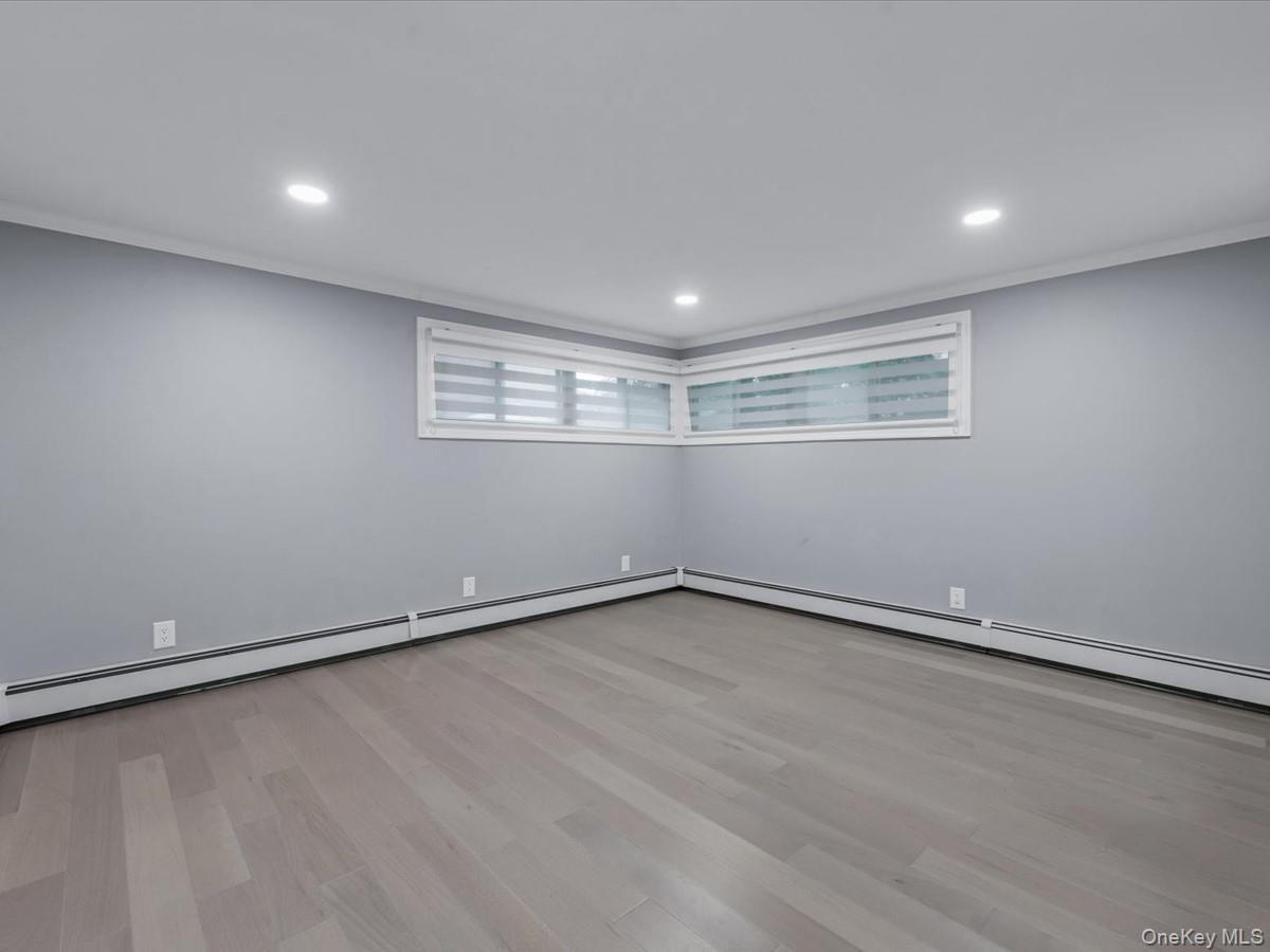 19 Ridge Drive East Roslyn, NY 11576 - Photo 17 of 33 a view of an empty room with a window