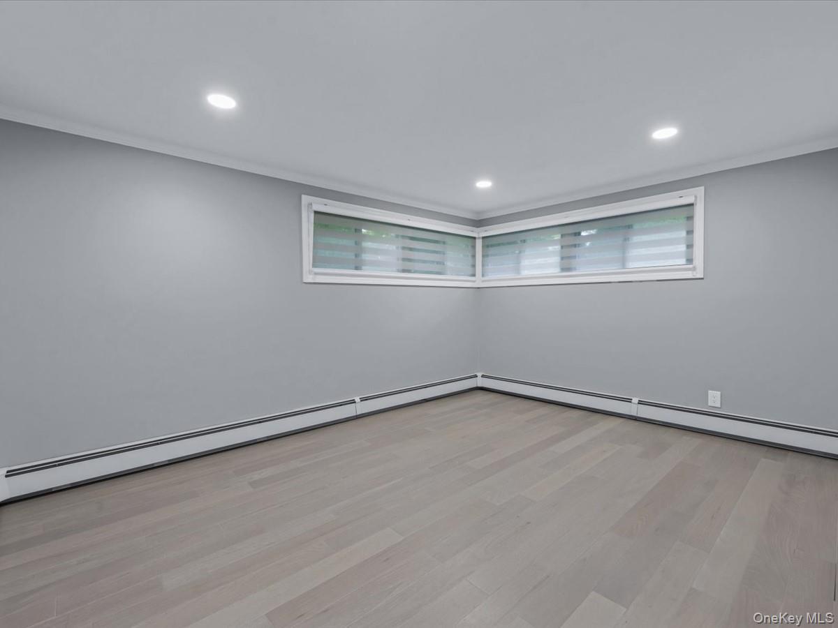 19 Ridge Drive East Roslyn, NY 11576 - Photo 21 of 33 a view of an empty room with a window