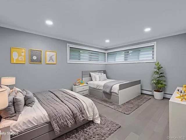 a bedroom with a bed and a couch