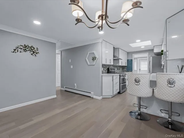 a view of a kitchen with table and a chair