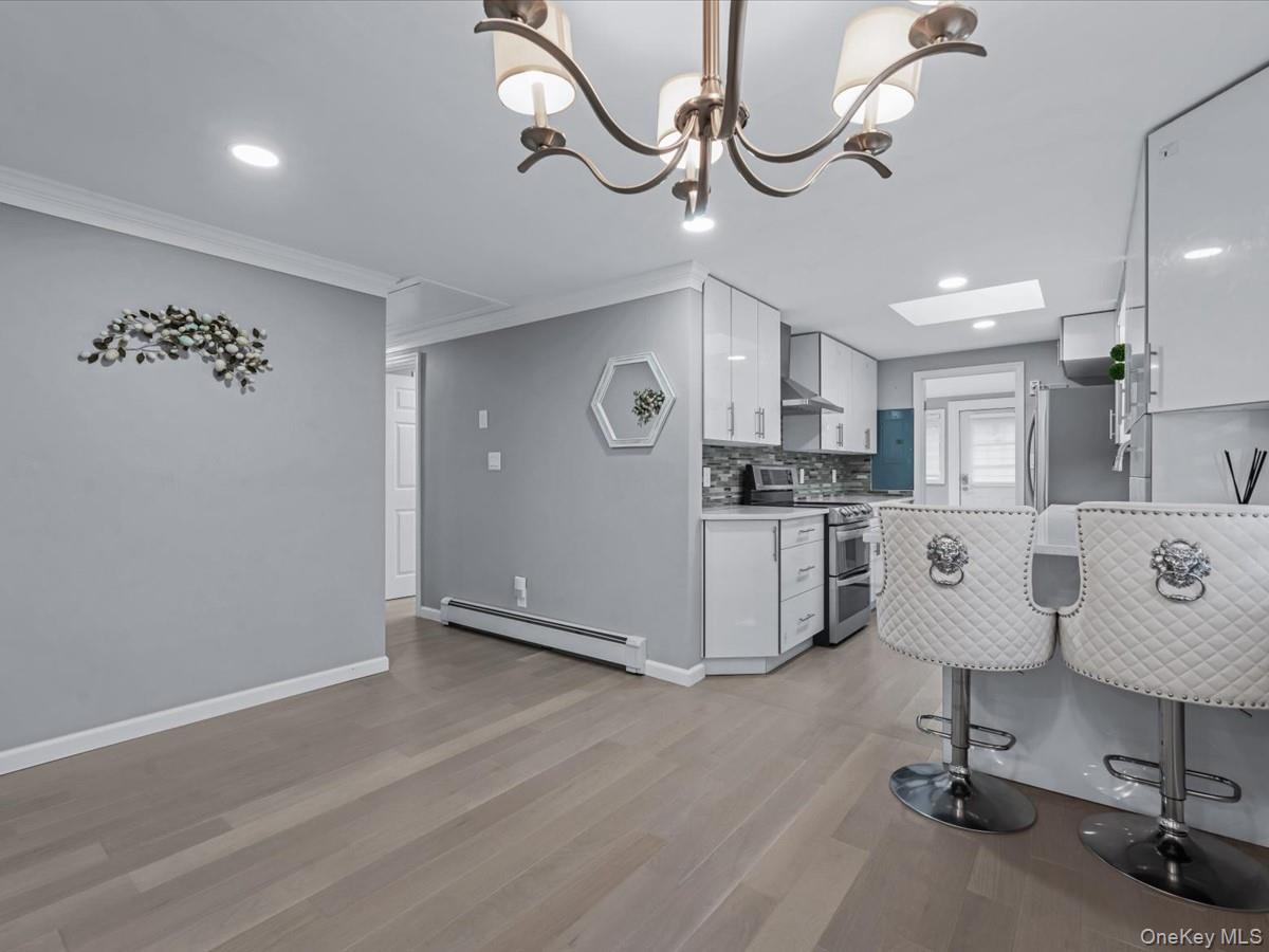 19 Ridge Drive East Roslyn, NY 11576 - Photo 9 of 33 a view of a kitchen with table and a chair