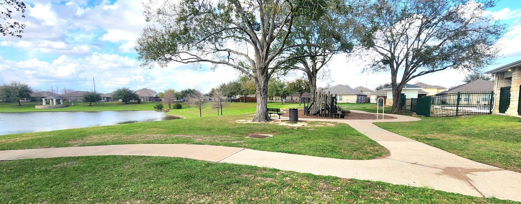 11211 Riata Canyon Drive Cypress, TX 77433 - Photo 29 of 33 a view of a park with large trees and playing ground