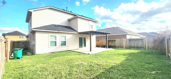 a kitchen with stainless steel appliances granite countertop a stove a refrigerator a sink and a oven with wooden floor