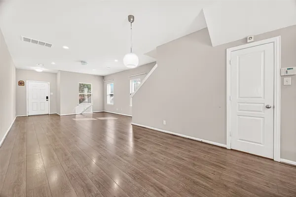 a white bath tub sitting next to a shower