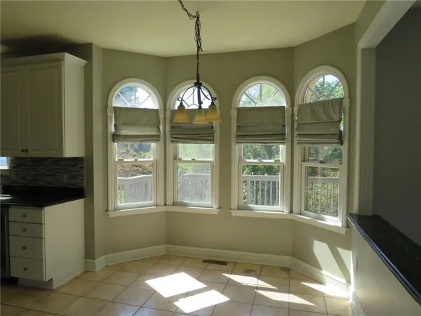 a view of a livingroom with windows