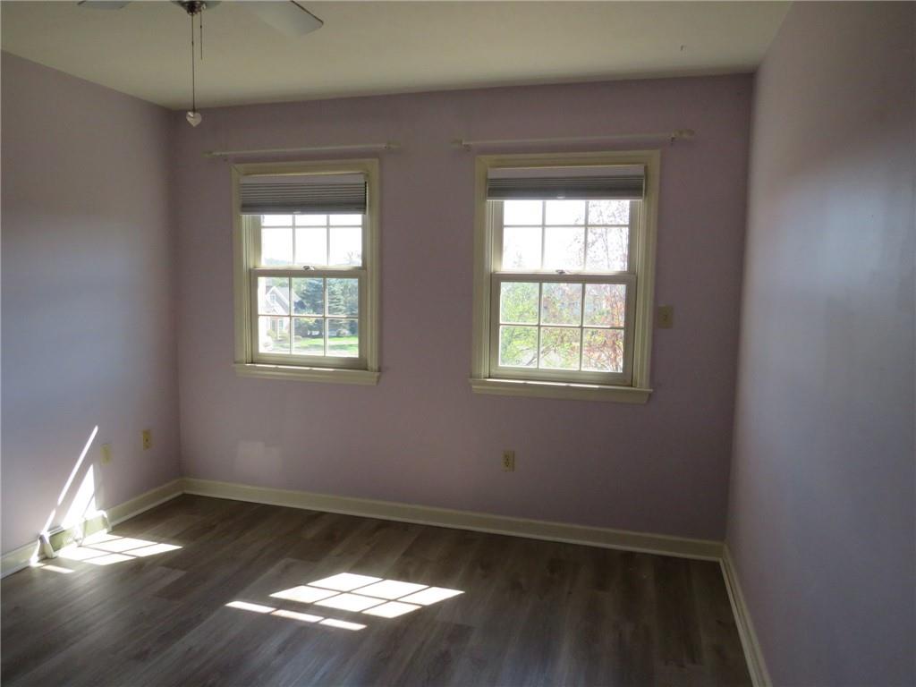 304 Scenic Ridge Court Mars, PA 16046 - Photo 25 of 49 a view of empty room with wooden floor and fan