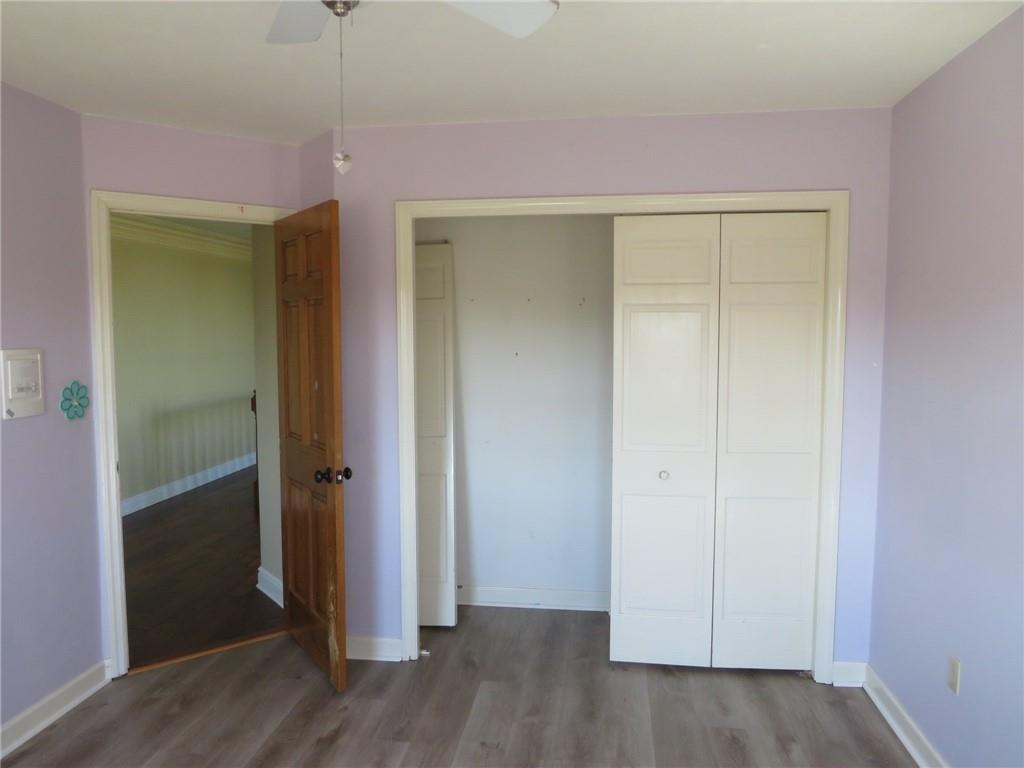304 Scenic Ridge Court Mars, PA 16046 - Photo 27 of 49 an empty room with wooden floor and closet