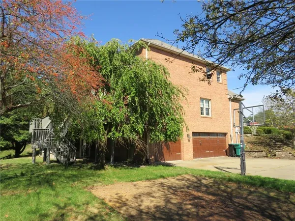 a backyard of a house with lots of green space