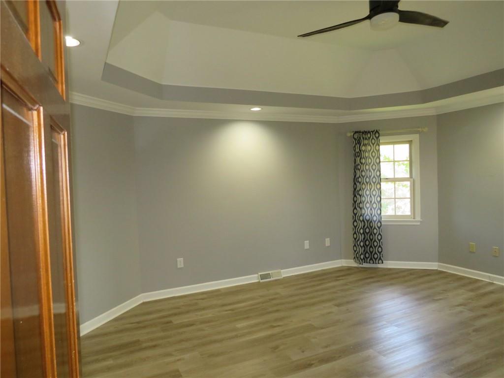 304 Scenic Ridge Court Mars, PA 16046 - Photo 39 of 49 a view of an empty room with wooden floor and a window