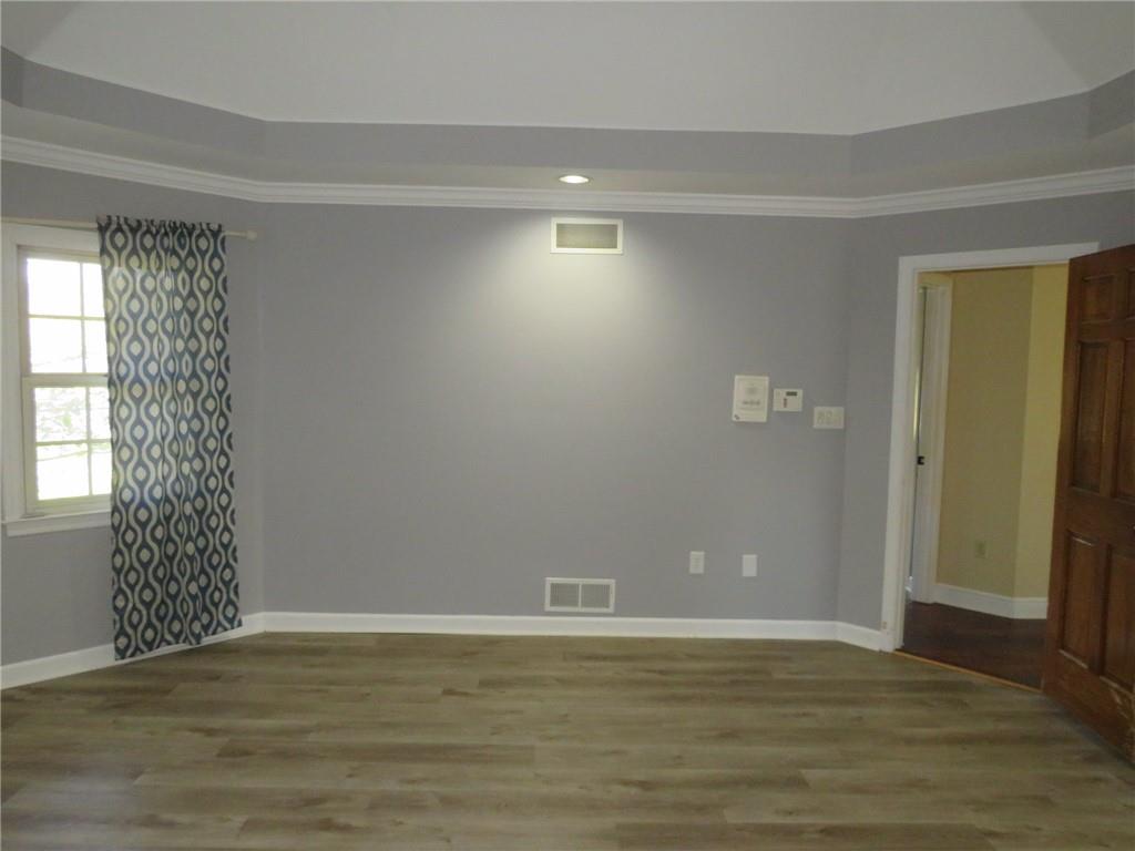 304 Scenic Ridge Court Mars, PA 16046 - Photo 43 of 49 a view of an empty room with wooden floor and a window