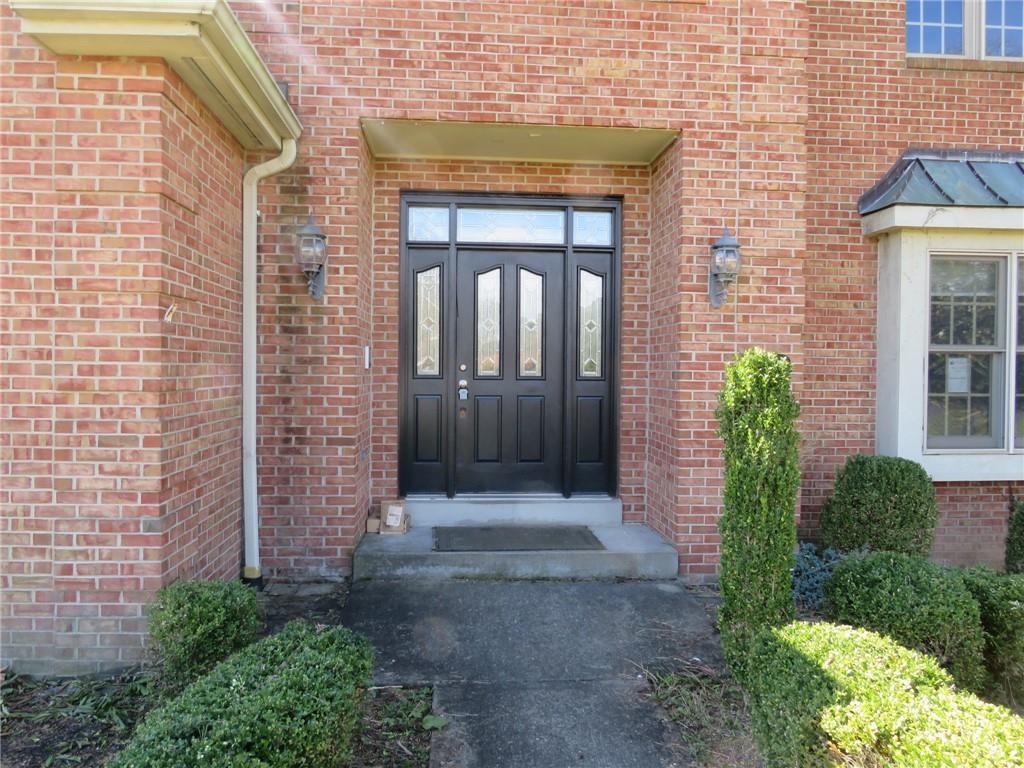 304 Scenic Ridge Court Mars, PA 16046 - Photo 5 of 49 a view of a brick house with many windows