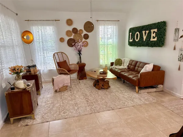 a living room with furniture and a window
