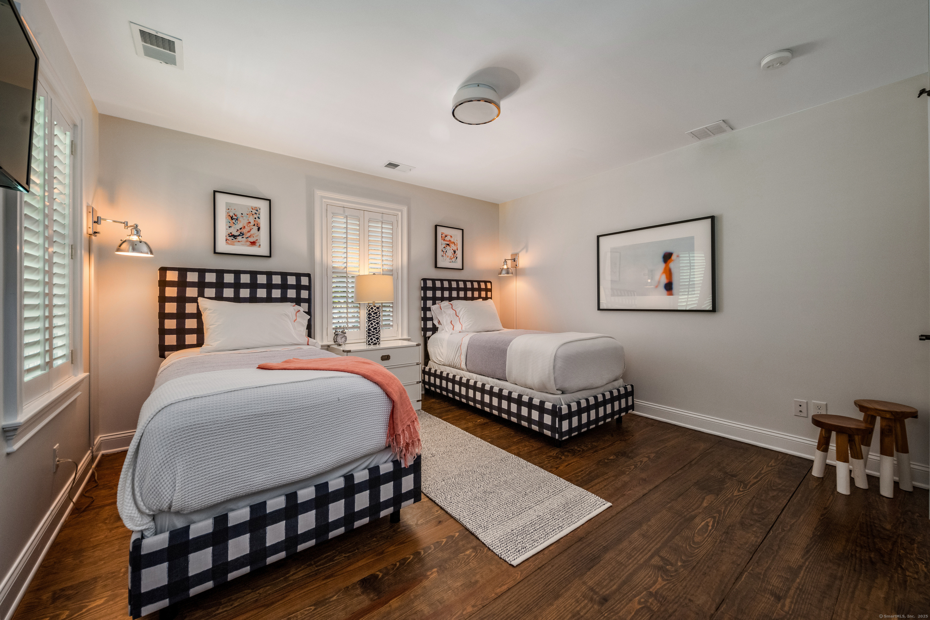 137 Liberty Street Madison, CT 06443 - Photo 19 of 40 a bedroom with a bed and a table