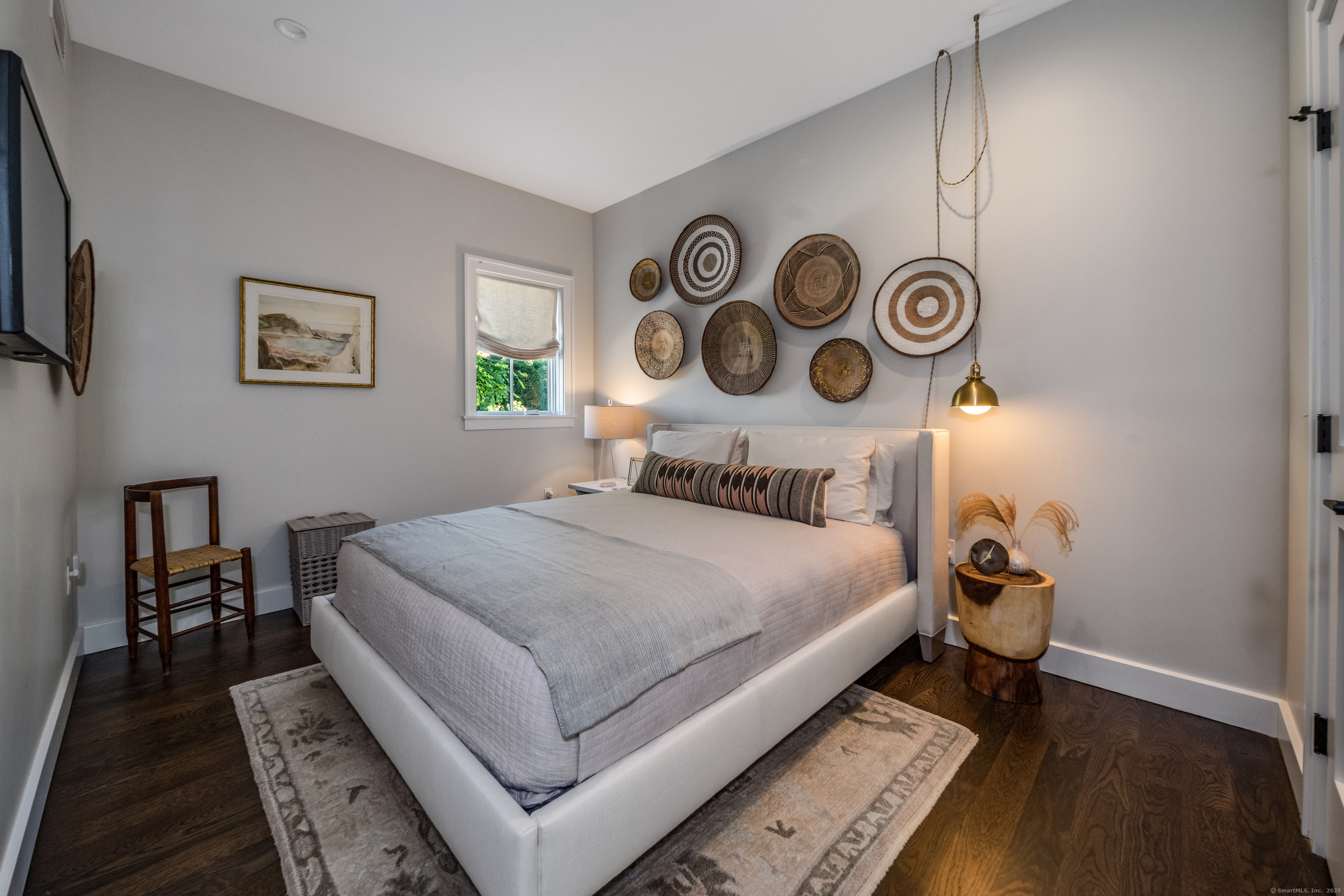 137 Liberty Street Madison, CT 06443 - Photo 25 of 40 a bedroom with a bed and a lamp on dresser