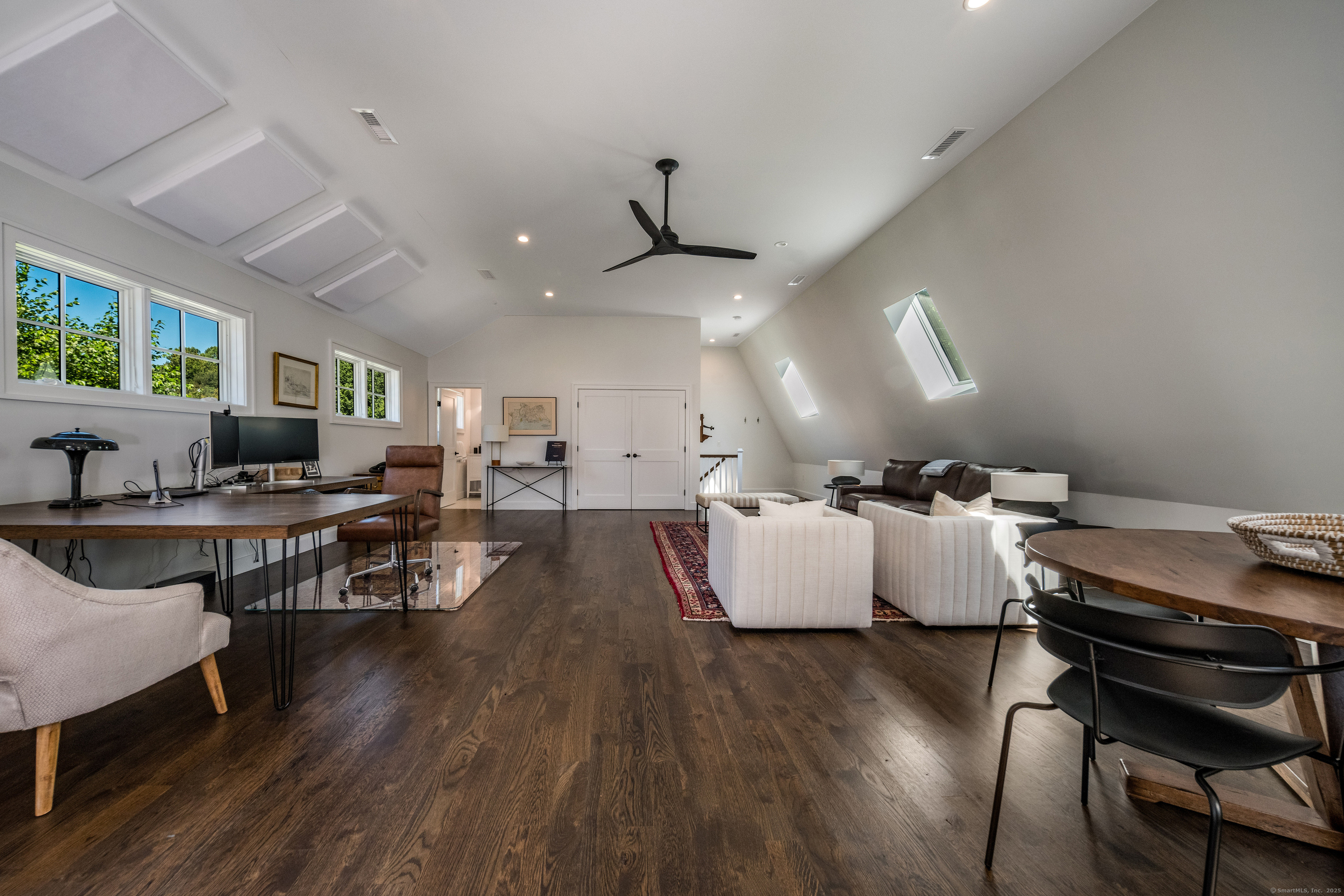 137 Liberty Street Madison, CT 06443 - Photo 27 of 40 a living room with furniture and wooden floor