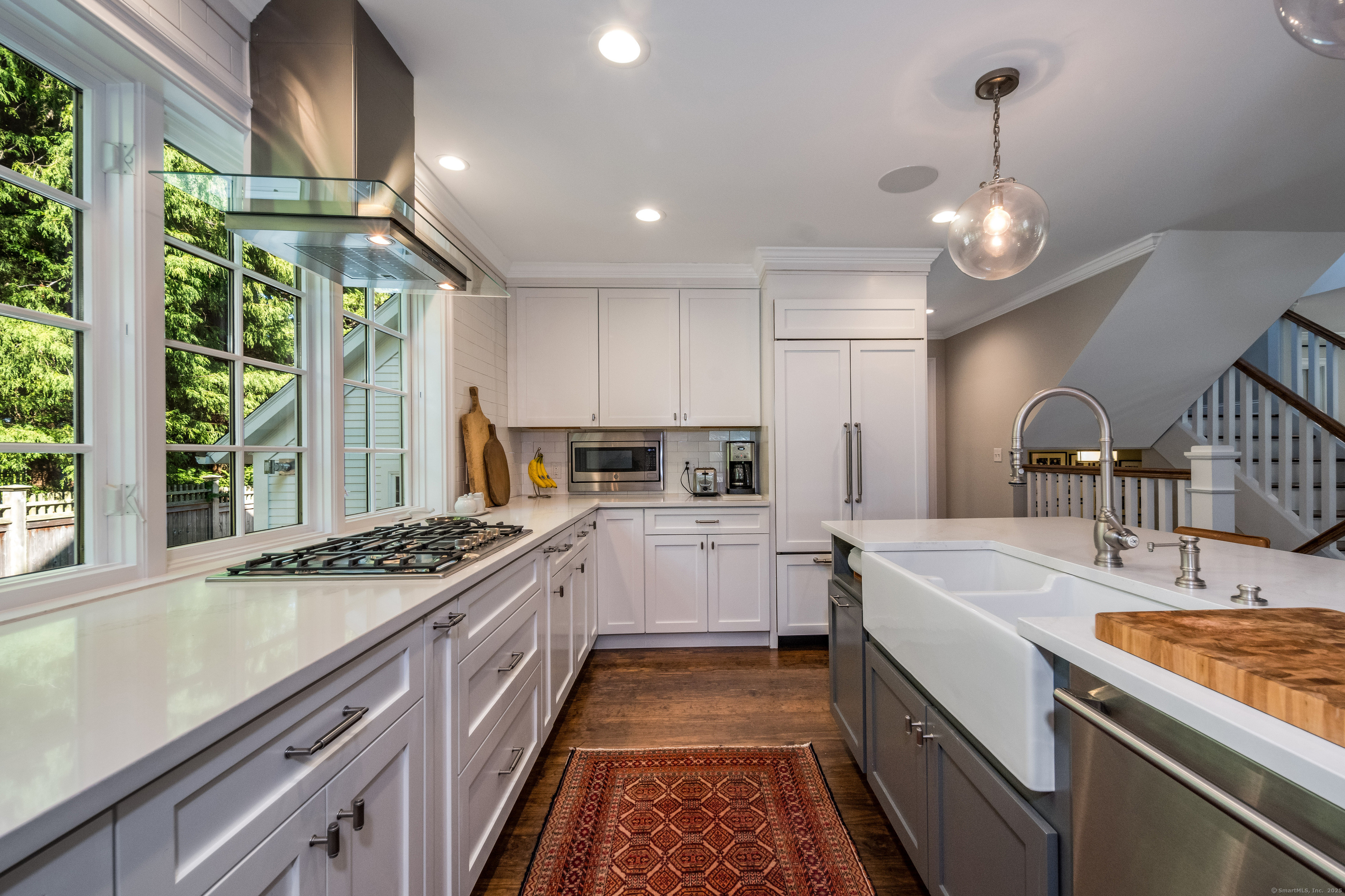137 Liberty Street Madison, CT 06443 - Photo 6 of 40 a kitchen that has a lot of cabinets in it