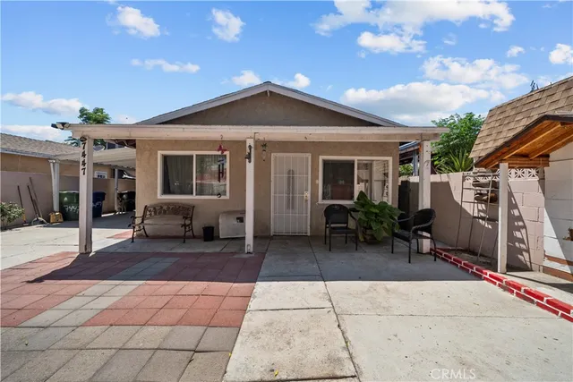 a patio with table and chairs