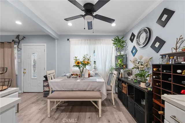 a dining room with furniture and window