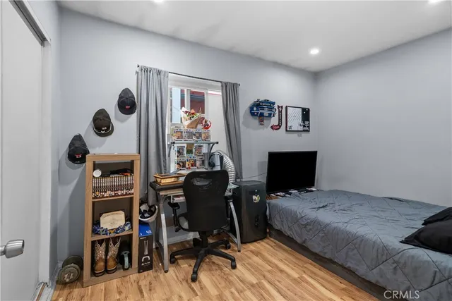 a bedroom with furniture and a bed