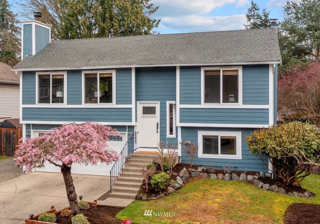 1723 225th Street Southeast Bothell, WA 98021 - Photo 1 of 40 a front view of a house with garden