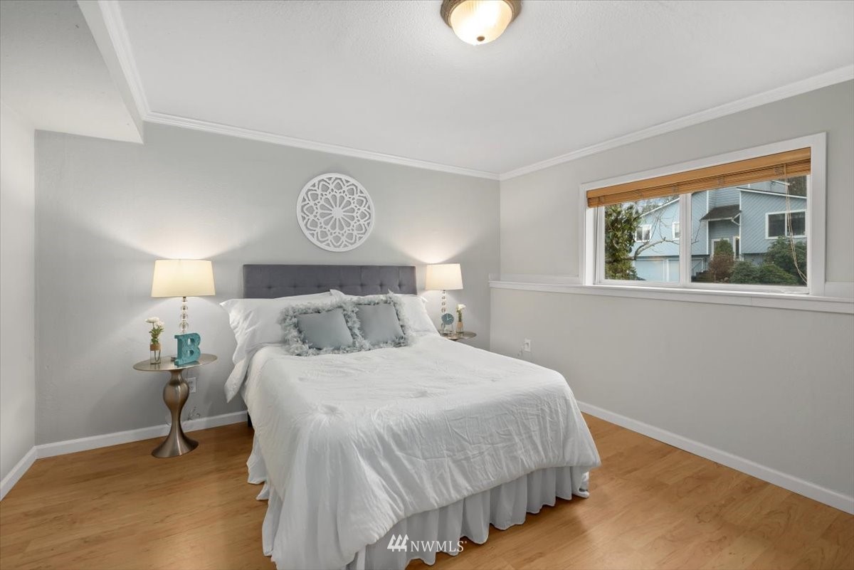 1723 225th Street Southeast Bothell, WA 98021 - Photo 17 of 40 a bedroom with a bed and a window