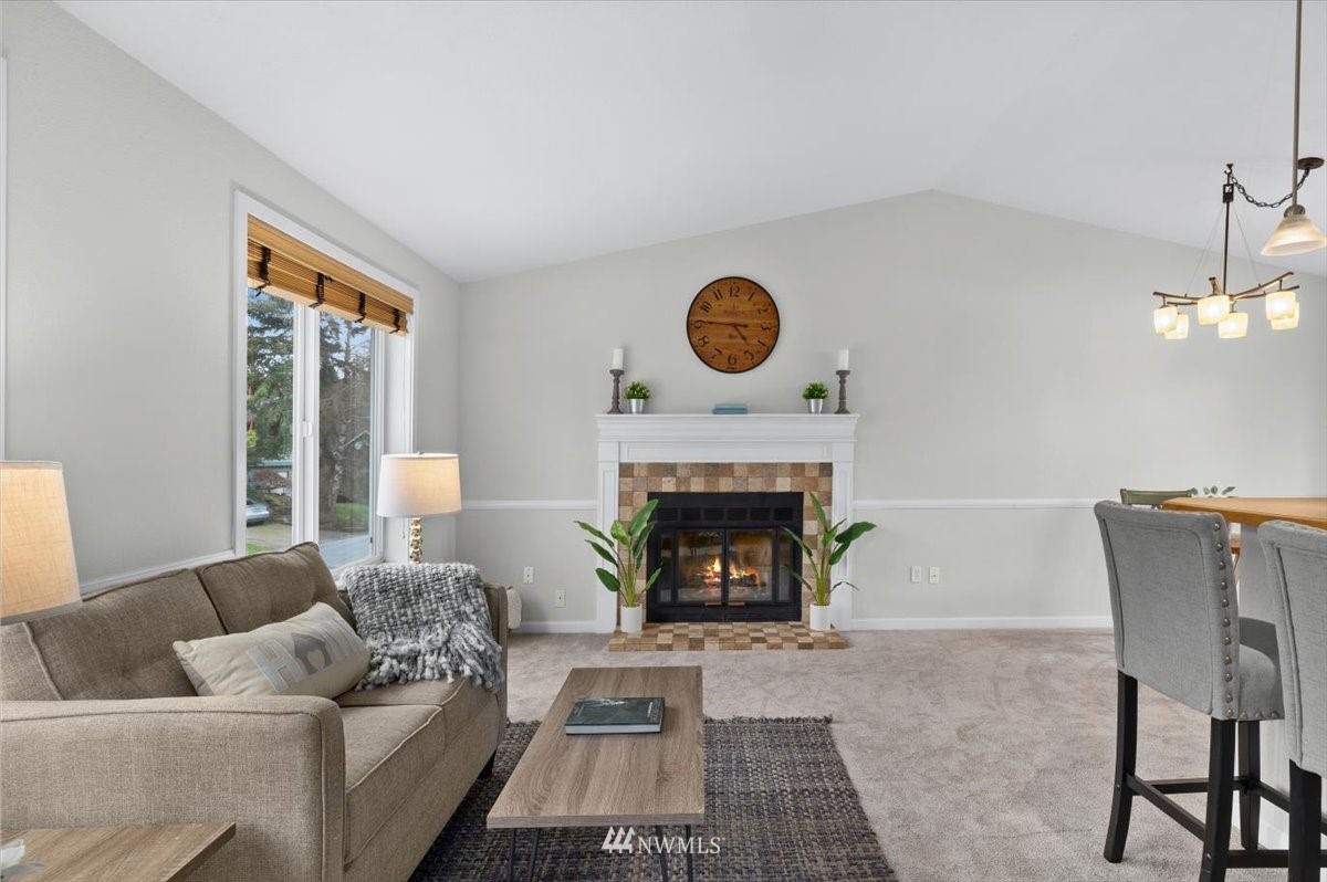 1723 225th Street Southeast Bothell, WA 98021 - Photo 2 of 40 a living room with furniture and a fireplace