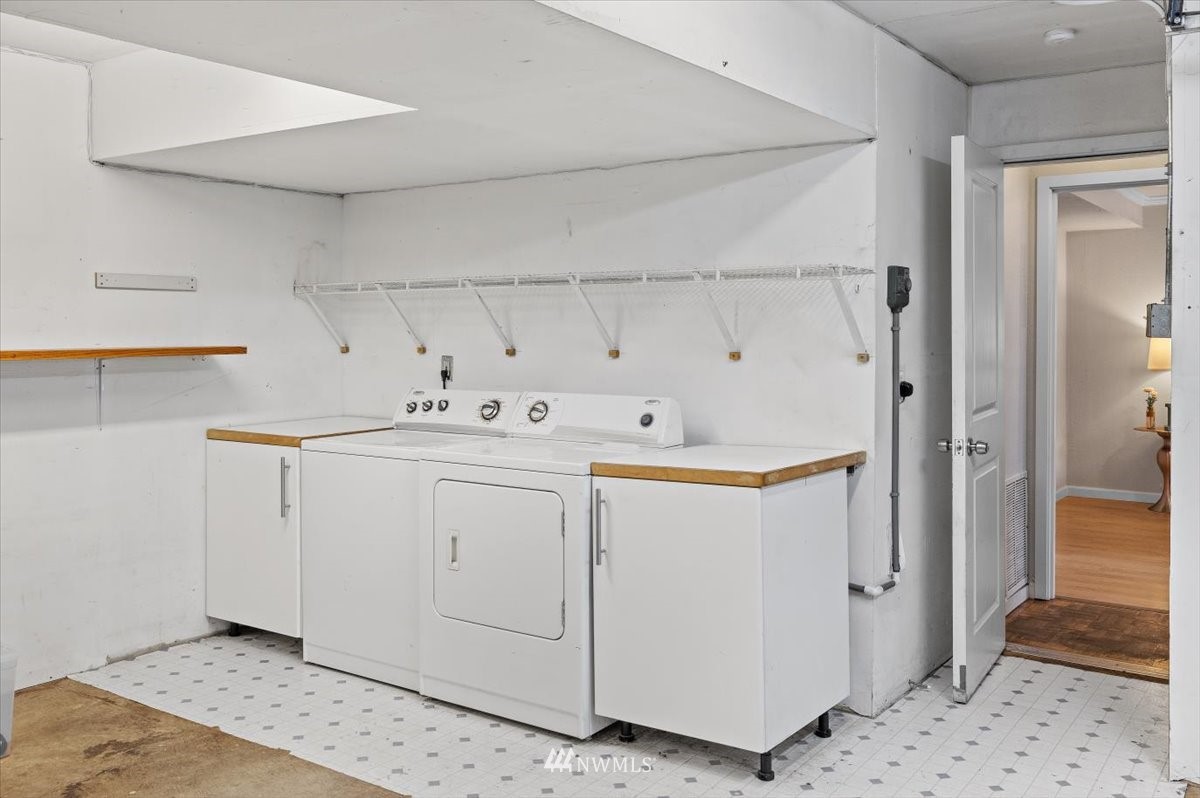 1723 225th Street Southeast Bothell, WA 98021 - Photo 24 of 40 a utility room with cabinets washer and dryer