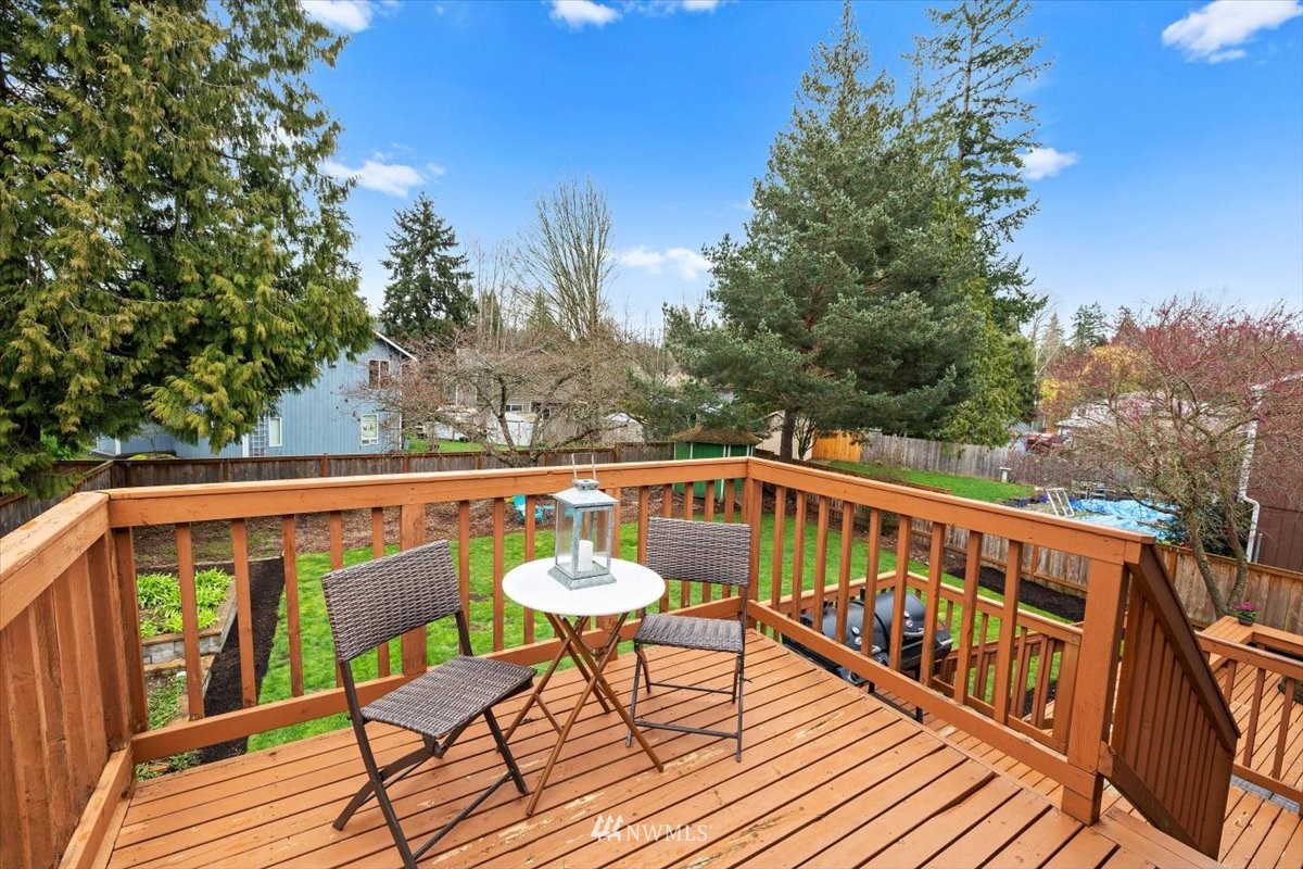 1723 225th Street Southeast Bothell, WA 98021 - Photo 29 of 40 a view of balcony with wooden floor and outdoor seating