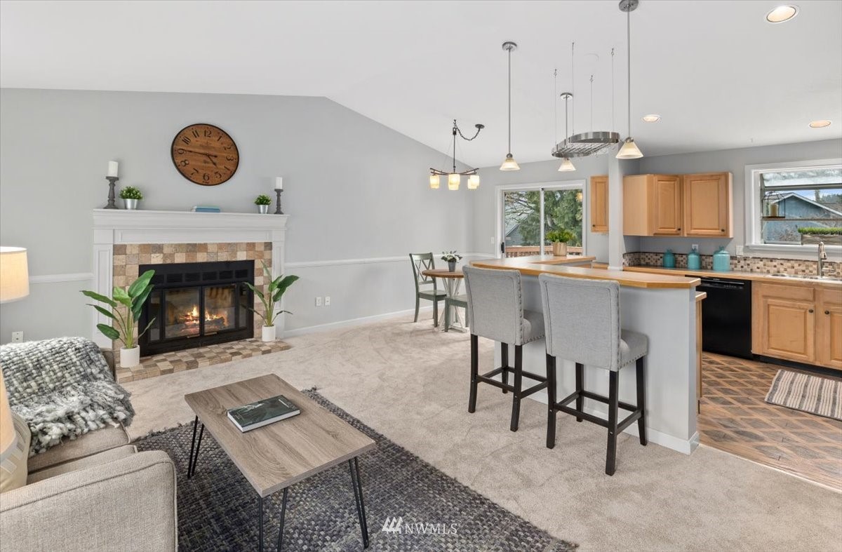 1723 225th Street Southeast Bothell, WA 98021 - Photo 3 of 40 a open kitchen with a table and chairs