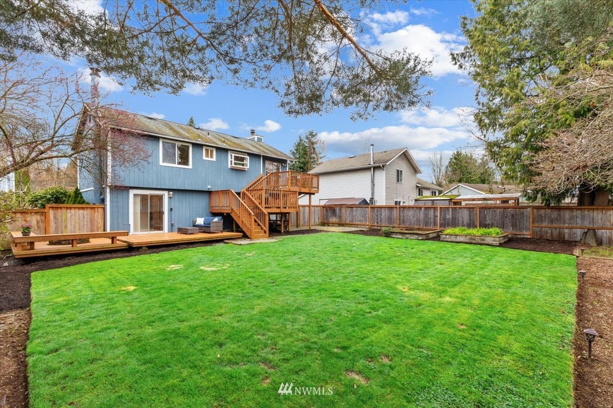 1723 225th Street Southeast Bothell, WA 98021 - Photo 33 of 40 a view of a house with a backyard porch and sitting area