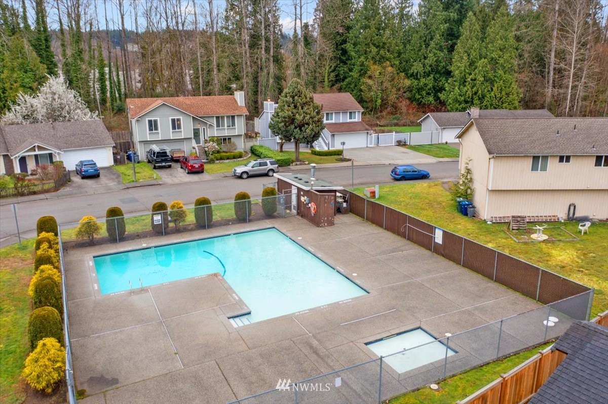 1723 225th Street Southeast Bothell, WA 98021 - Photo 39 of 40 an aerial view of a house with swimming pool and large trees
