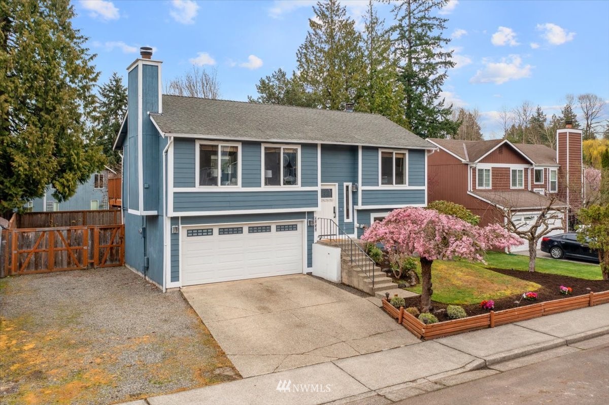 1723 225th Street Southeast Bothell, WA 98021 - Photo 40 of 40 a front view of a house with a yard garage and outdoor seating