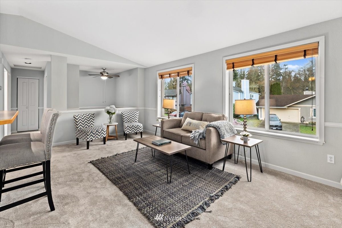 1723 225th Street Southeast Bothell, WA 98021 - Photo 6 of 40 a living room with furniture and a large window
