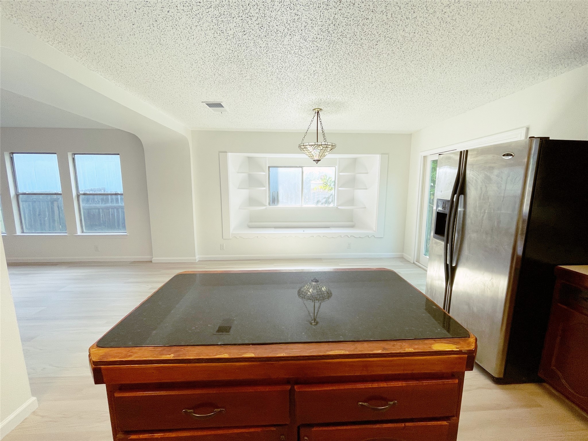 1103 Pike Path Round Rock, TX 78665 - Photo 16 of 36 As you chop vegetables or prep your meals, you have a clear view into the adjacent dining room, where sunlight streams in and sets the table aglow.