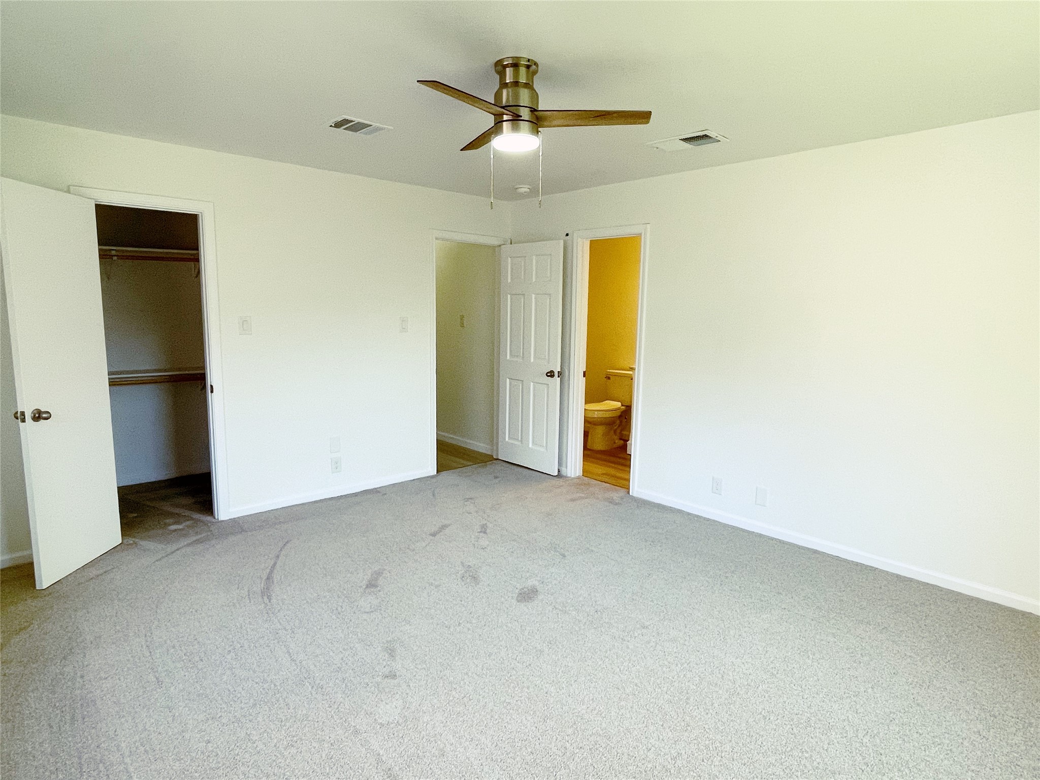 1103 Pike Path Round Rock, TX 78665 - Photo 19 of 36 Whether you're curling up with a book or drifting off to sleep, the primary bedroom promises a peaceful haven for restful nights and peaceful mornings.