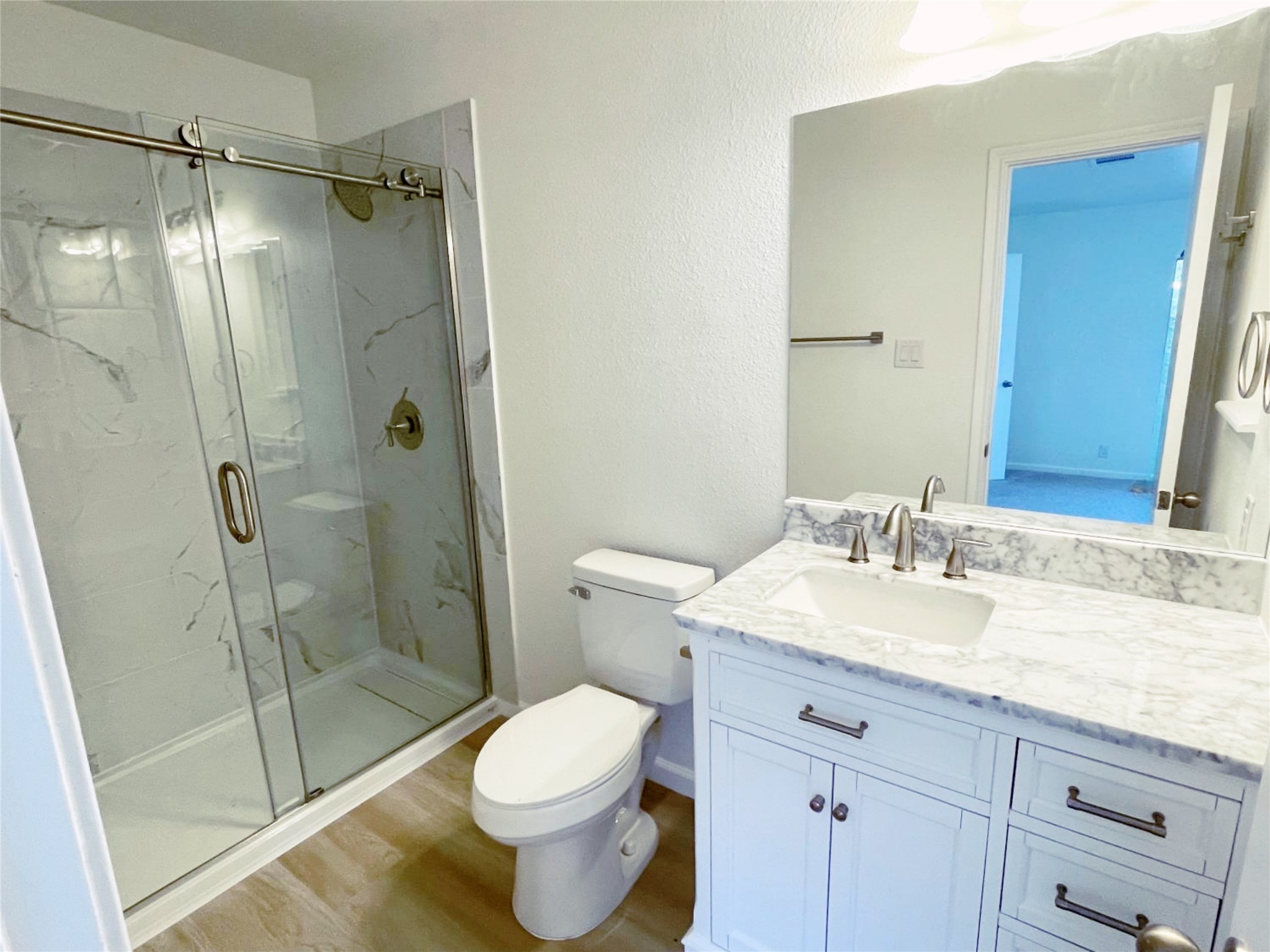 1103 Pike Path Round Rock, TX 78665 - Photo 20 of 36 Step into luxury in the primary bathroom, where a stunning walk-in shower awaits. This spacious shower is a centerpiece of relaxation and elegance.