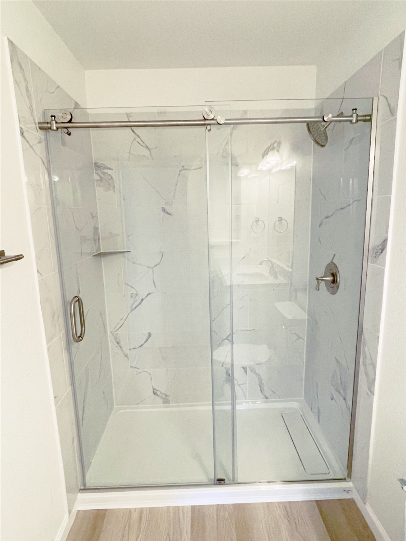 1103 Pike Path Round Rock, TX 78665 - Photo 22 of 36 Imagine starting your day or unwinding in the evening under the gentle flow of water in this inviting and stylish shower—a perfect blend of comfort and indulgence.